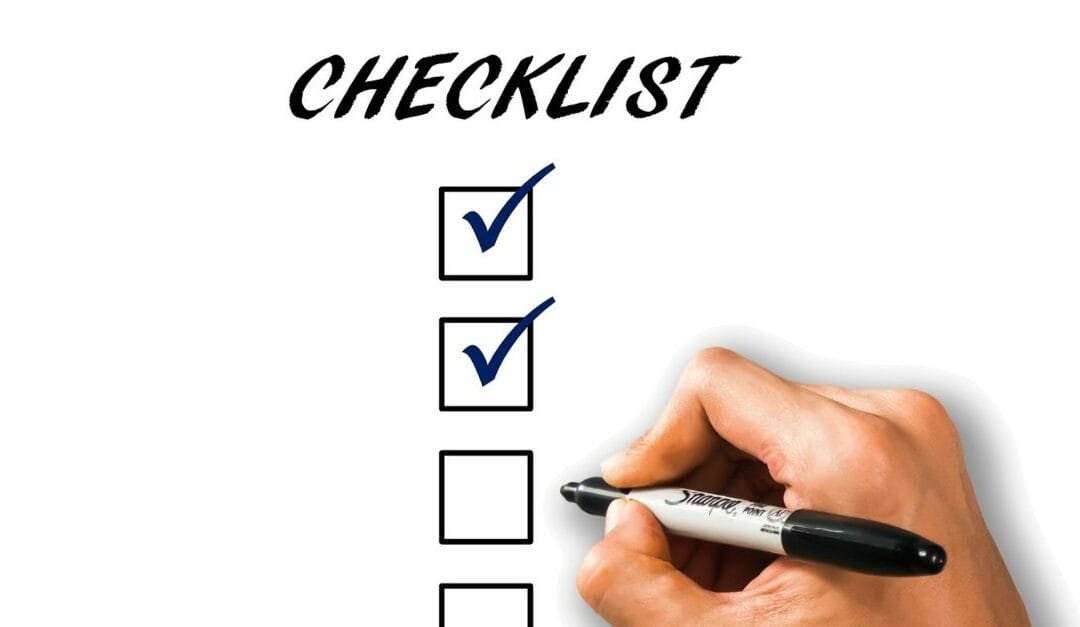 hand checking off franchise checklist